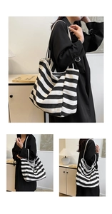 Close-up of striped canvas tote bag showing thick durable fabric and shoulder straps