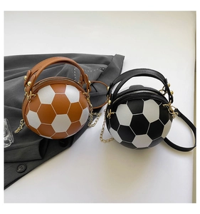 Detail of soccer shaped handbags with premium faux leather texture and golden metal chains