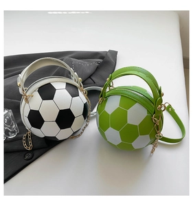 Detail of soccer ball shaped handbags with classic black white and green white leather textures