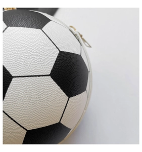 Detailed macro view showing the high-quality lychee texture of the football-shaped handbag