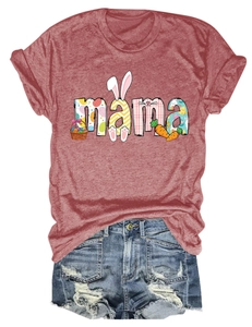 Detail of mama text with bunny and easter egg prints on brick red cotton t-shirt fabric