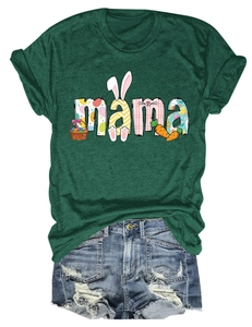 Flat lay of dark green T-shirt with MAMA Easter print and distressed denim shorts