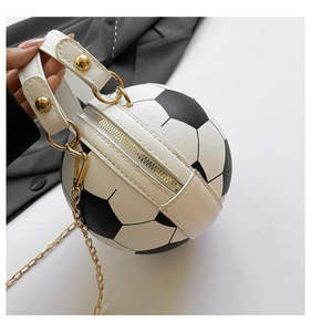 Detail showing soccer ball shaped handbag with litchi grain faux leather and gold chain