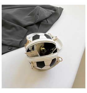 Top-down view of open soccer-shaped purse showing capacity for phone and lipstick