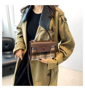 Chic brown PU and vintage plaid wool handbag shown in a stylish fashion lifestyle setting