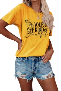 Detail of yellow cotton T-shirt featuring 'Be Your Own Kind of Beautiful' print and butterfly