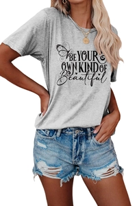 Detail of grey crewneck T-shirt with butterfly print and high waist ripped denim shorts