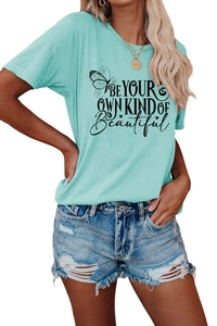 Detail of turquoise crew neck T-shirt featuring Be Your Own Kind of Beautiful print