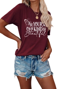 Detail of burgundy T-shirt with BE YOUR OWN KIND OF Beautiful print and butterfly graphic