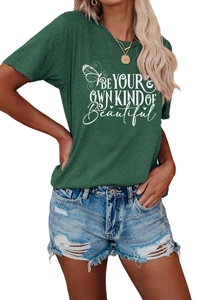 Detail of dark green t-shirt with BE YOUR OWN KIND OF Beautiful print and butterfly graphic