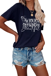 Detail of navy blue crew neck T-shirt featuring white butterfly print and artistic text
