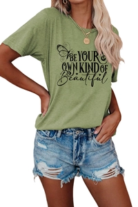 Detail of sage green T-shirt with BE YOUR OWN KIND OF BEAUTIFUL text and butterfly print