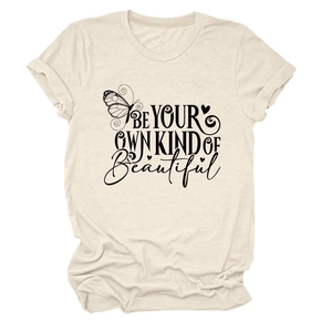 Close-up of beige t-shirt featuring 'Be Your Own Kind of Beautiful' text and butterfly print
