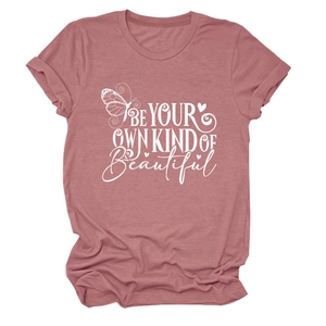 Detail of dusty rose T-shirt fabric with white BE YOUR OWN KIND OF BEAUTIFUL print