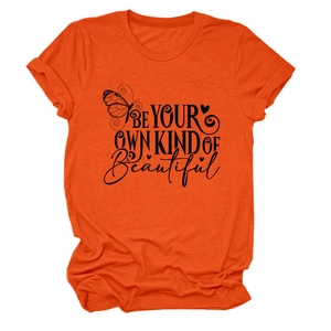 Detail of the orange cotton T-shirt featuring a butterfly and Be Your Own Kind Of Beautiful print
