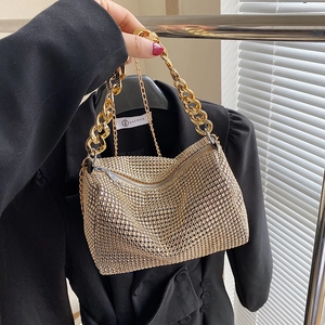 Sparkling gold cylinder rhinestone crossbody bag with elegant thick metallic chain strap