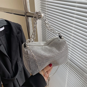 Elegant silver cylinder handbag with sparkling rhinestones and metal chain strap