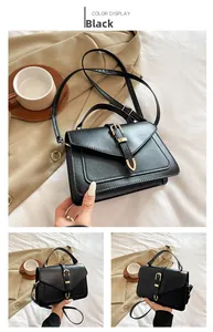 Détail du sac à main en cuir PU noir mat avec boucle dorée et bandoulière réglable