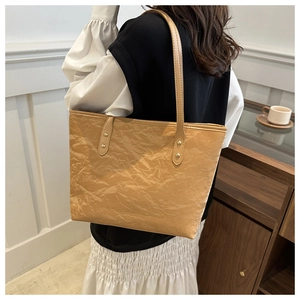 Large khaki tote bag with pleated texture and gold rivets for women's daily commute