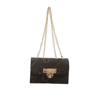 Vintage quilted chain crossbody bag with heart locket and luxury monogram leather pattern