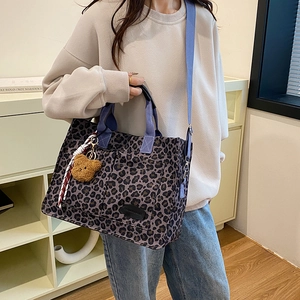 Leopard print canvas tote bag with purple straps and cute bear charm for women