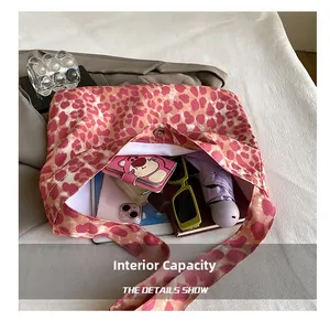 Detail shot of pink leopard print tote bag interior with magnetic clasp and large capacity