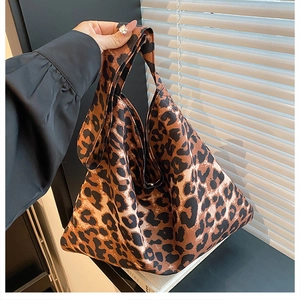 Macro detail of leopard print tote bag with soft texture and wild fashion pattern