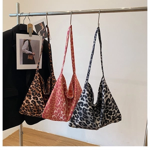Hobo tote bags featuring leopard prints in brown, pink, and grey canvas materials