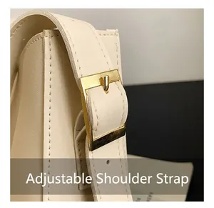Close-up of adjustable strap with gold square buckle on beige PU leather shoulder bag