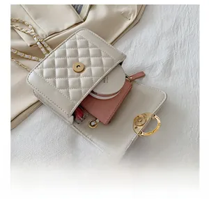 Mini white quilted crossbody bag showing interior storage for wallet, lipstick and cushion