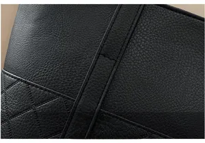 Close-up of black lychee grain leather with precise stitching and diamond quilting