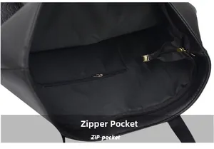 Close-up of the black tote bag interior with a functional zipper pocket and fabric lining