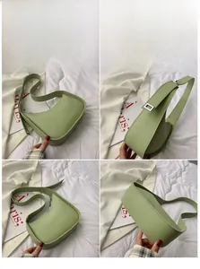 Detail showing the light green crescent bag with silver hardware and embossed logo