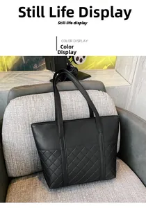 Detail showing the classic diamond quilted stitching on the black PU leather tote bag surface