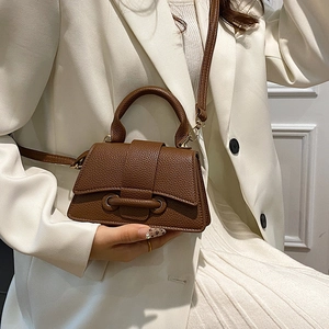 Brown litchi grain small crossbody bag with curved handle and detachable shoulder strap