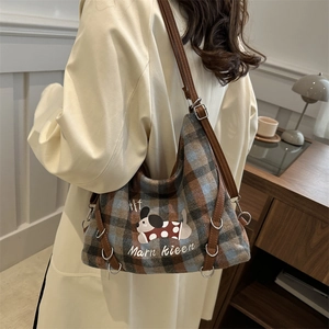 Retro plaid tote bag with dog print and leather straps worn by model for daily commute