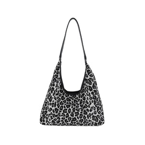 Chic black and white leopard print hobo tote bag with a wide strap for daily commute