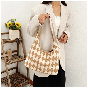 Detail of retro diamond pattern tote bag with wide handle shown in lifestyle setting