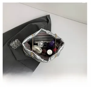 Detailed interior of silver quilted tote bag showing spacious capacity for daily essentials
