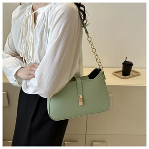 Chic light green shoulder bag with gold chain strap and metallic clasp closure detail