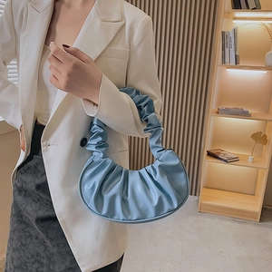 Sky blue pleated cloud handbag made of soft PU leather with a minimalist curved design