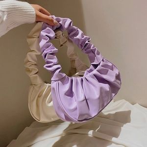 Minimalist macaron cloud dumpling bags in purple and cream white with ruched handles