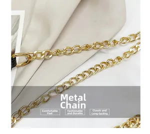 Close-up of glossy gold hardware chain link with a polished finish for shoulder bags