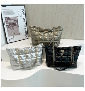 Three quilted tote bags in silver gold and black with chain straps and deer charms