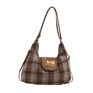 Vintage plaid hobo tote bag with brown leather straps and cartoon dog print detail