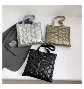 Three quilted tote bags in silver, bronze, and black colors showing glossy nylon texture