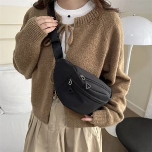 Minimalist black nylon crossbody chest bag with adjustable strap and double zippers