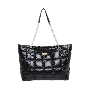 Glossy black quilted tote bag with golden deer charm and chain shoulder strap