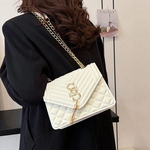 Stylish white quilted shoulder bag with V-shaped texture and golden chain strap for women