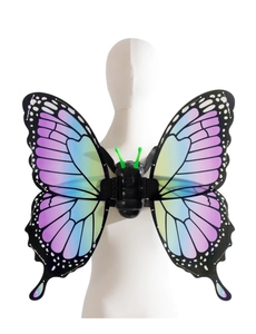 Close-up of electric butterfly wings with purple gradient and polka dots on a mannequin